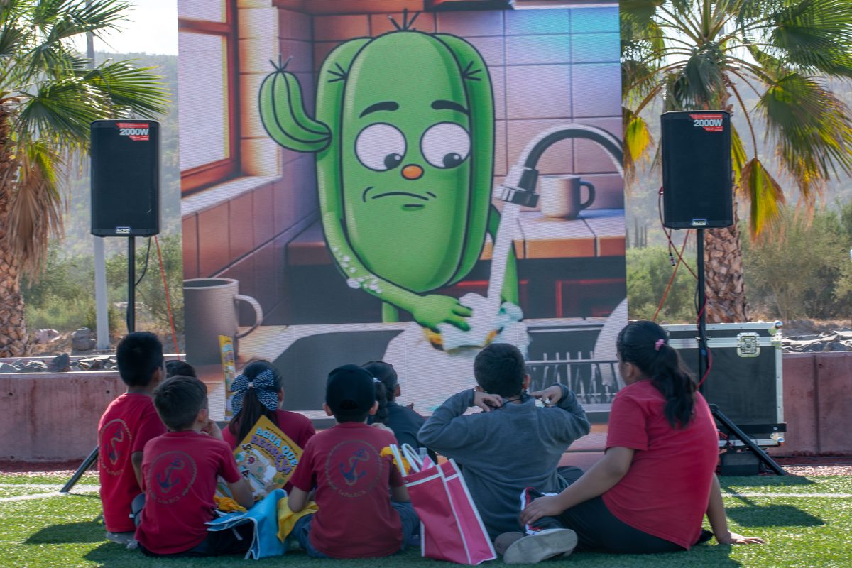 Children watching the animated series outdoors in La Paz
